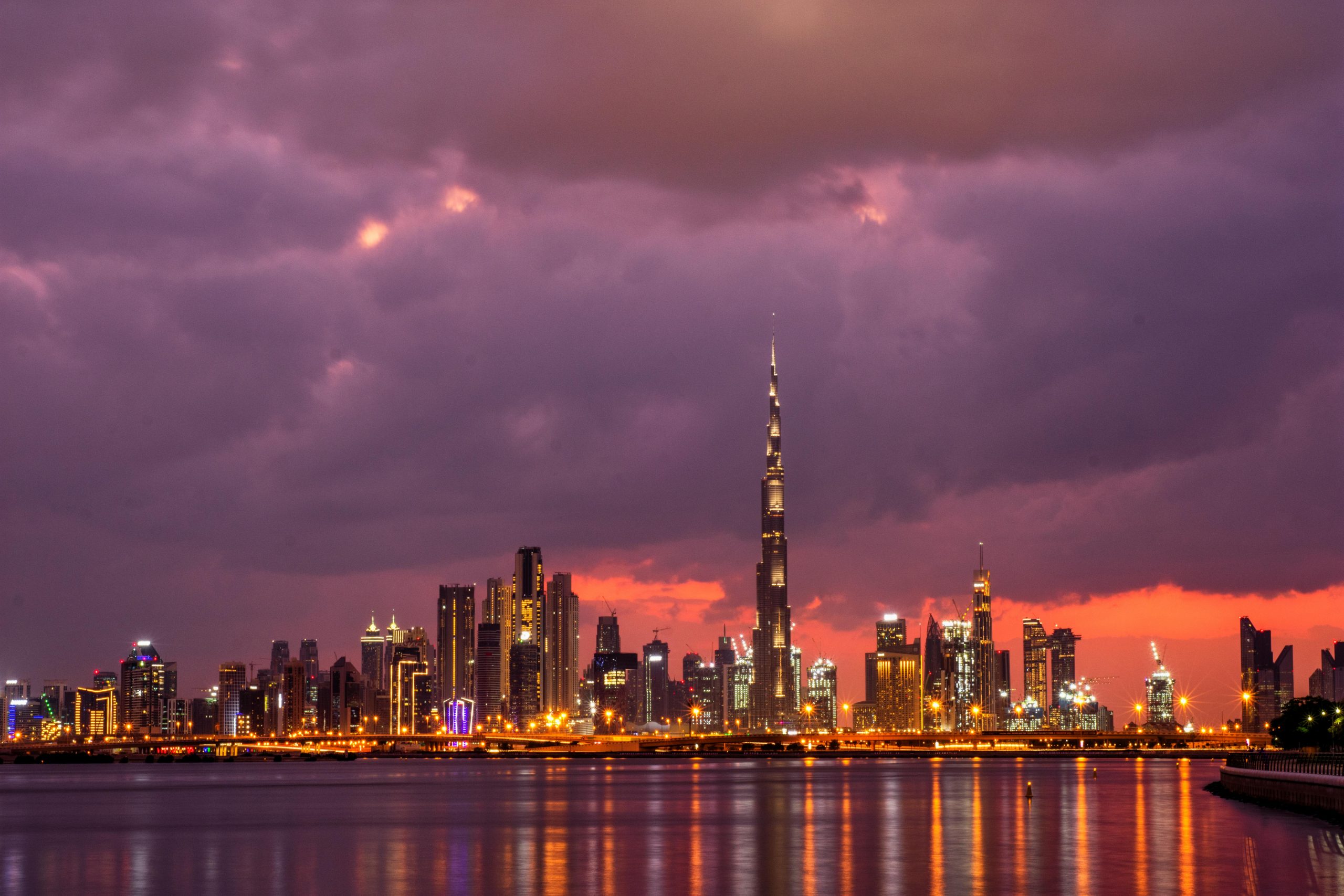 Stunning sunset view of Dubai skyline featuring the iconic Burj Khalifa.